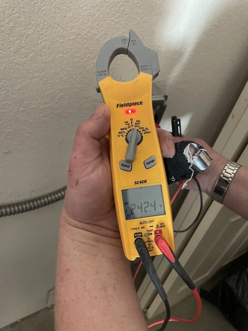 Voltage testing with clamp meter during Generator Installation in Traverse City